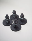 Five Tactic Engineering magnetic supports for MaxTrax MK2 LITE and XTREME recovery boards, SLS 3D printed nylon mounts with stainless steel quick release pins on circular rubber coated neodymium magnet bases, product group photo on light gray background