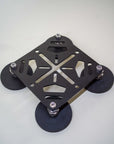 Tactic Engineering magnetic RotoPax mounting plate with four rubber coated neodymium magnets at corners, black powder coated steel X frame design with bolt mounting points, product photo on light gray background from the Ultimate Magnetic Accessories Bundle