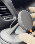 Animated GIF showing hand adjusting Tactic Engineering MagSafe phone mount on Iveco Daily dashboard, demonstrating adjustable ball joint positioning for optimal viewing angle, Qi wireless charging pad on SLS 3D printed nylon base near air vents