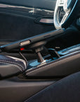 Tactic Engineering MagSafe Qi2 phone mount with iPhone in the Smoker's Package ashtray recess of a Porsche Boxster Cayman 981 centre console, no drilling, no adhesive