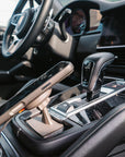 iPhone held in landscape on the Tactic Engineering magnetic phone mount in a Porsche Cayenne (2018-2023) centre console