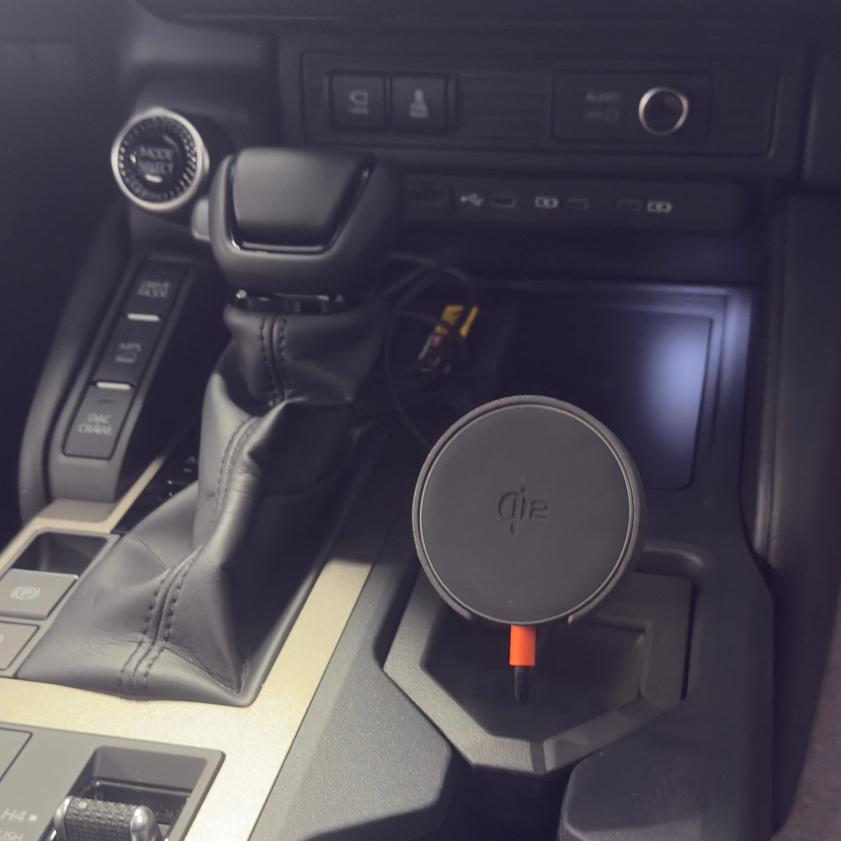 Tactic Engineering MagSafe phone mount installed in the front cupholder of a 2024 Toyota Land Cruiser 250