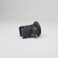 Tactic Engineering magnetic shower mount, SLS 3D printed nylon holder with embossed Tactic logo and rubber coated neodymium magnet base, compact clip design for securely holding shower head hose on van exterior, product photo on gray background