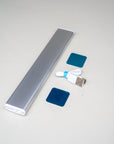 Tactic Engineering Magnetic Motion Sense Van Lamp back view showing aluminum body with included USB C charging cable and two adhesive magnetic metal sticker plates for mounting