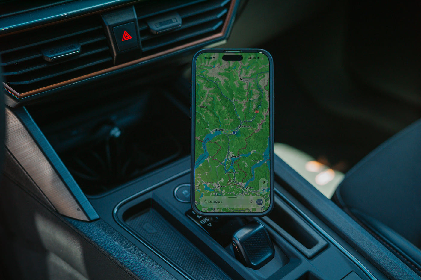 Cupra Formentor phone mount holding iPhone with Apple Maps next to the gear selector, MagSafe-compatible Qi2 wireless charging, no drilling no adhesive