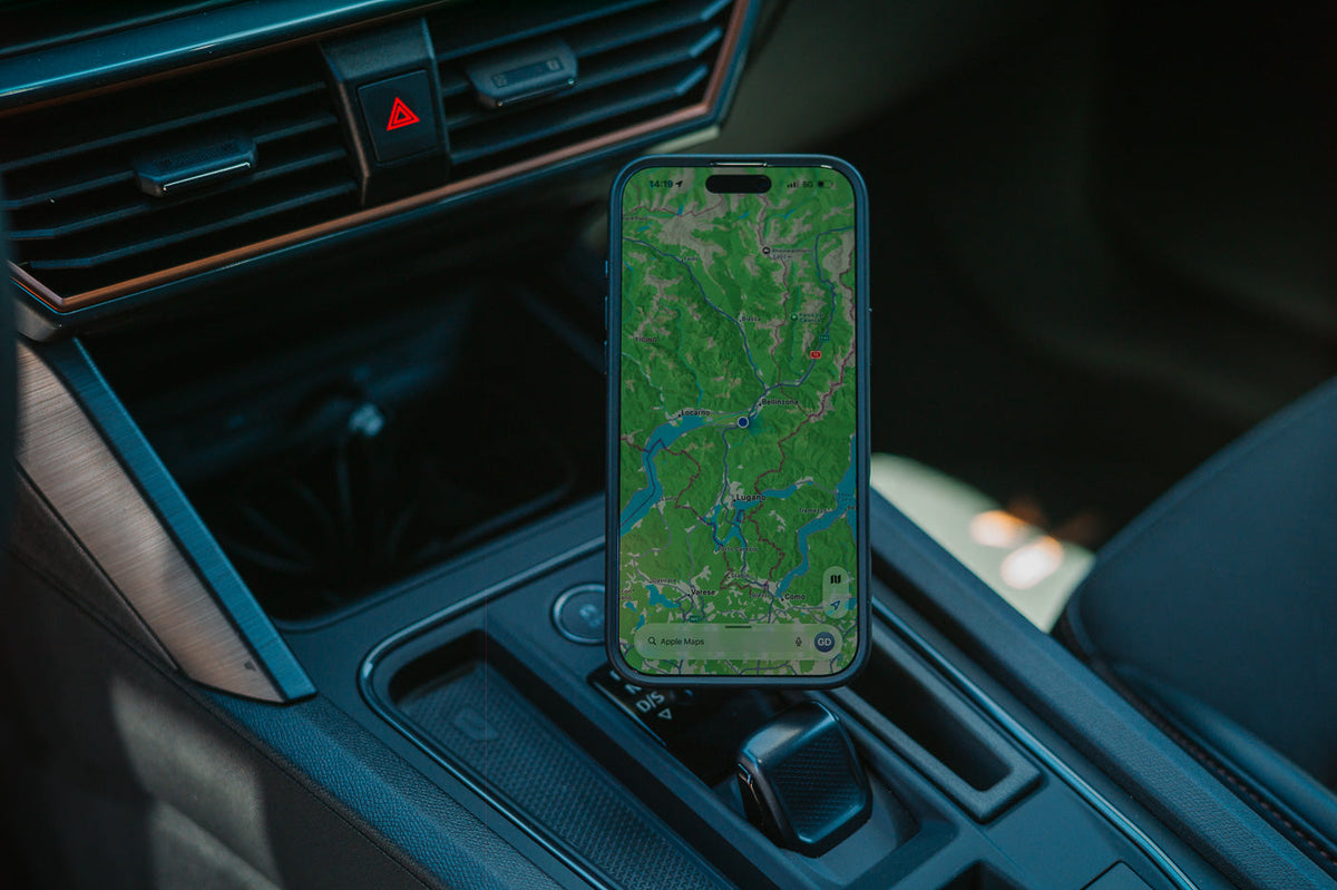 Cupra Leon 2020-2023 phone mount holding iPhone with Apple Maps next to the gear selector, MagSafe-compatible Qi2 wireless charging, no drilling no adhesive