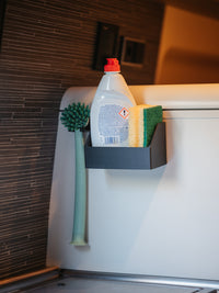 Tactic Engineering modular soap holder mounted in Hymer Grand Canyon S kitchen holding dish soap bottle, cleaning brush and sponges, black SLS 3D printed design with magnetic or bracket mounting options