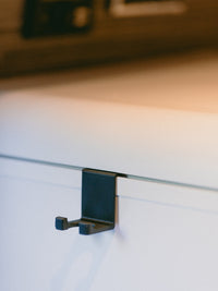 Tactic Engineering Hymer kitchen brush holder in black, rail mounted hook designed for the Hymer Grand Canyon S kitchen rail system, no tools required installation