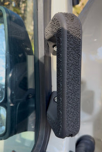 Mercedes Sprinter 907 ergonomic door handle 3D printed textured SLS nylon grip installed on van interior door close up
