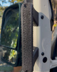 Mercedes Sprinter 907 ergonomic door handle exterior view showing 3D printed SLS nylon textured grip mounted on white van door