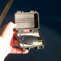 Tactic Engineering SecureMate 2.0 magnetic wallet held open showing van key, credit cards and cash inside waterproof case with industrial strength magnets for hiding under your vehicle