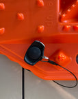 Two orange Sumex recovery boards mounted flat to a van side panel with Tactic Engineering magnetic quick-release supports