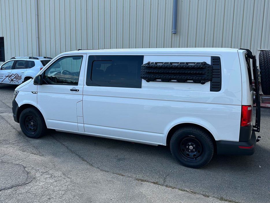 White VW Transporter Carrying Max Trax Recovery Boards with Tactic Engineering's original mounts