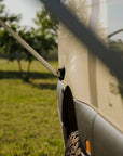 Detail of Tactic Engineering magnetic Thule awning support holding the awning arm on the Weinsberg X-Pedition 4x4 Sprinter by Ferrigato Camper