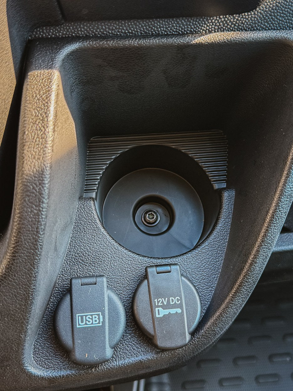 Fitment check: the cup holder this mount fits, with the step in the middle and the TX25 Torx screw at the bottom