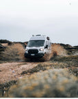 Francesco Furlani driving his Ford BunkerVan through Portuguese dune trails, equipped with Tactic Engineering magnetic mounts for TRED recovery boards