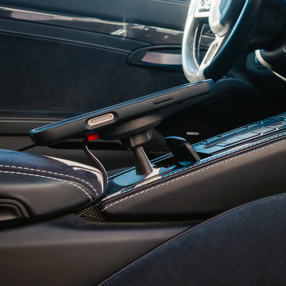 Tactic Engineering MagSafe Qi2 phone mount with iPhone in the Smoker's Package ashtray recess of a Porsche 911 991 centre console, no drilling, no adhesive