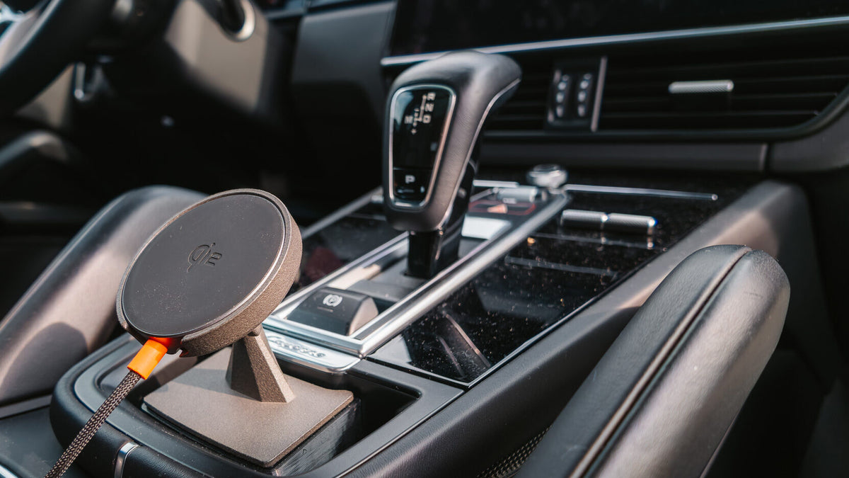 Tactic Engineering magnetic MagSafe phone mount installed in the storage pocket ahead of the gear selector in a Porsche Cayenne (2018-2023)