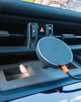 Porsche Macan EV centre console with the Tactic Engineering MagSafe phone mount installed, Qi2 charger seated below the dashboard vents