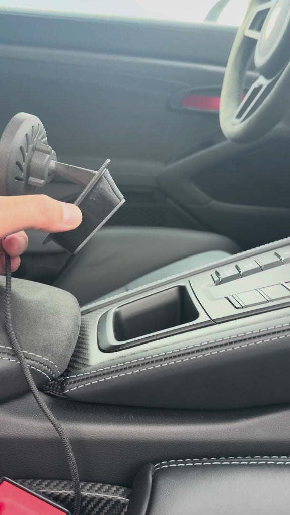 Porsche 718 Cayman and Boxster magnetic phone mount demonstration in the centre console