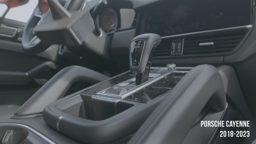 Porsche Cayenne 2018–2023 magnetic phone mount installation video — mount slots into the storage pocket ahead of the gear selector, no drilling, no adhesive. MagSafe charging head snaps on and the phone attaches magnetically. Tactic Engineering, Swiss made.