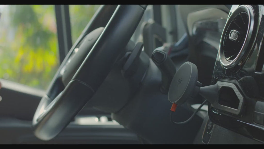 iPhone snaps onto the Tactic Engineering MagSafe phone mount in a Mercedes Sprinter 907 cab. One hand, no cradle, charging starts on contact.