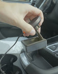 Installing the Tactic Engineering magnetic phone mount in the rubber-lined console cubby of a 2022-2026 Porsche Macan and snapping an iPhone onto the MagSafe Qi2 charger, no drilling, no tools