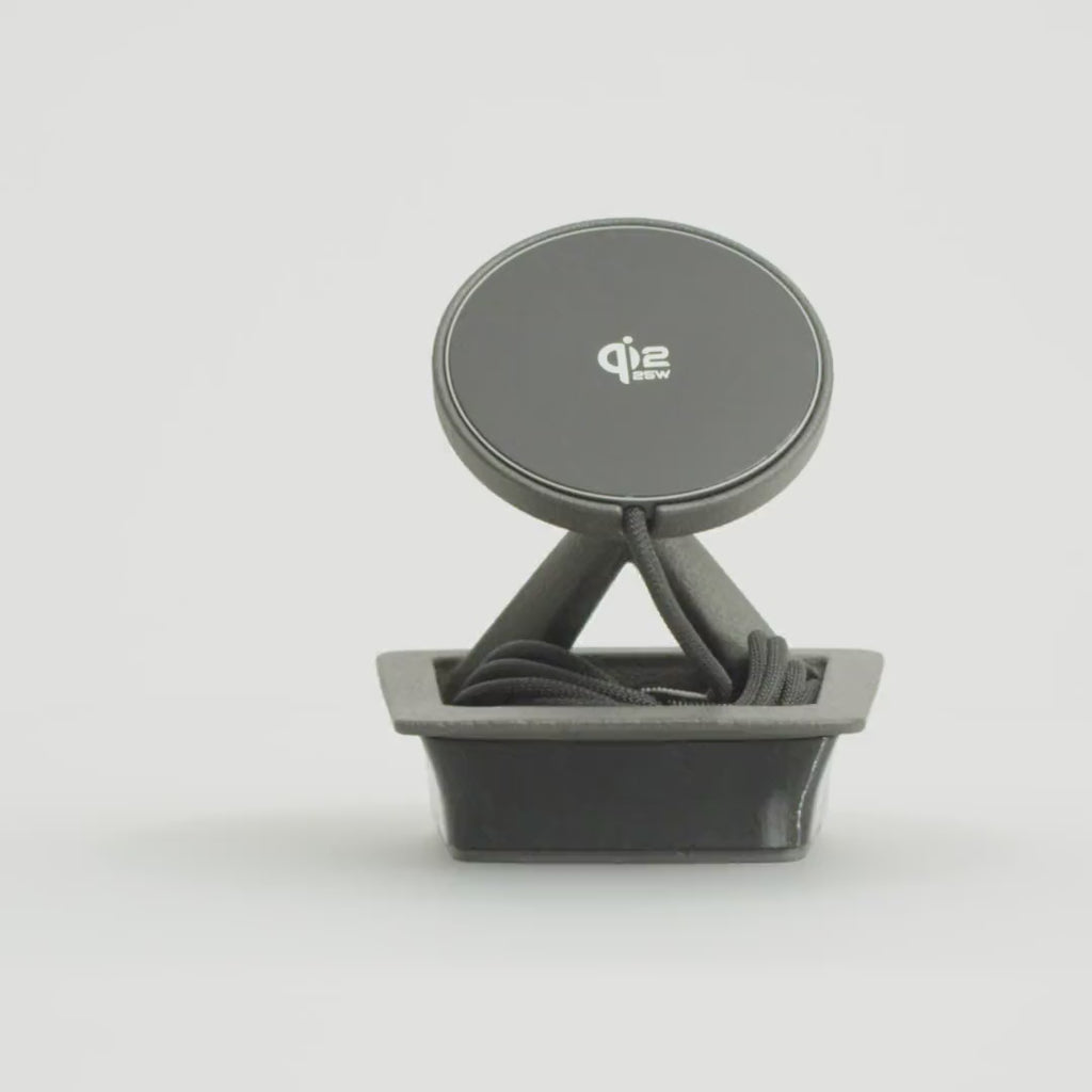 Porsche 911 (991) phone mount for cars without the smoker's package, by Tactic Engineering, rotating 360°: vehicle-specific SLS nylon base designed and built in Switzerland, with MagSafe-compatible Qi2 wireless charger.