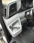 Renault Master 2024+ driver side dashboard: the moulded tray with cupholder where the Tactic Engineering phone mount sits. No drilling, no adhesive.