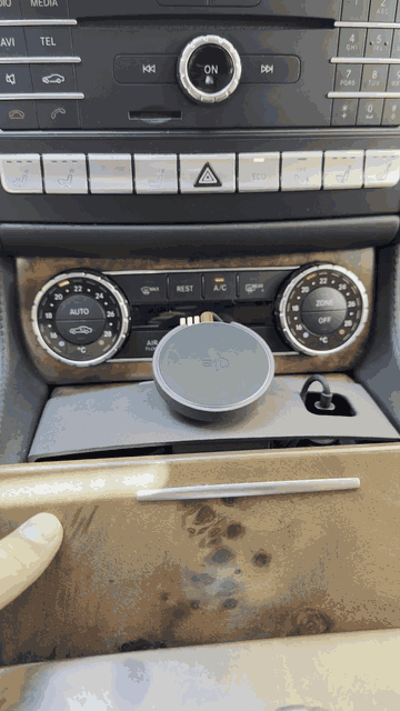 Tactic MagSafe holder push-fitted into the Mercedes CLS / E-Class center console cupholder — no tools, mechanical lock fit.