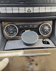 Tactic MagSafe holder push-fitted into the Mercedes CLS / E-Class center console cupholder — no tools, mechanical lock fit.