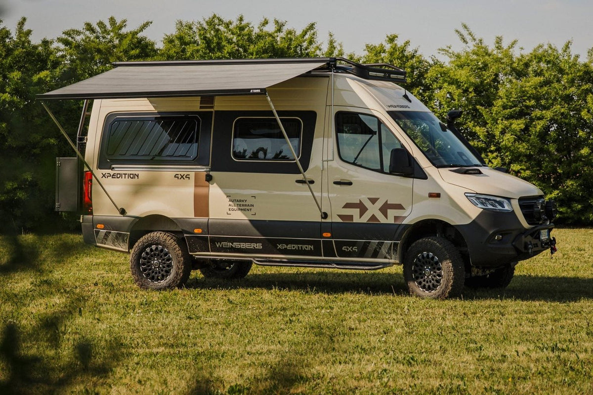 Mercedes Sprinter camper with the awning out, legs held by magnetic supports
