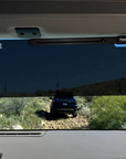 Rosen visor upgrade installed inside INEOS Grenadier with UV blocking acrylic panel deployed while off road driving