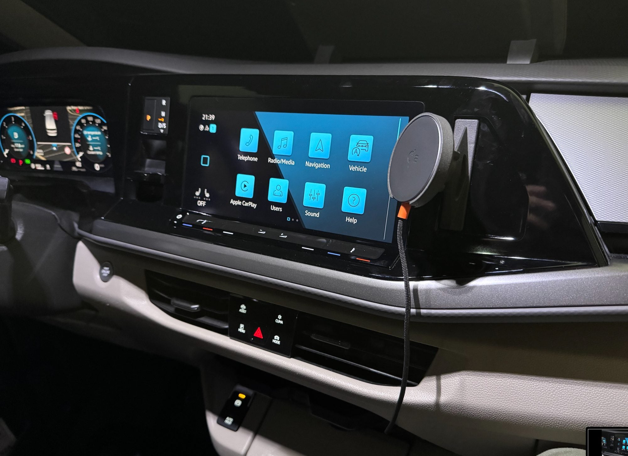 VW T7 Multivan MagSafe phone mount installed on the dashboard beside the infotainment screen, vehicle-specific no-drill fit by Tactic Engineering, Swiss made